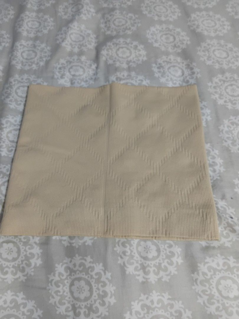 Beige Ribbed Waist Trainer Belt (Category: Undergarments & Loungewear) located in Manila. Submitted by ramcyanthony (Listing ID 1441915687, Image 1). Description: - Beige waist trainer belt - Ribbed texture with a diamond pattern - Stretchy and supportive material - Helps with shaping and provides support - Measuring tape included for size reference.