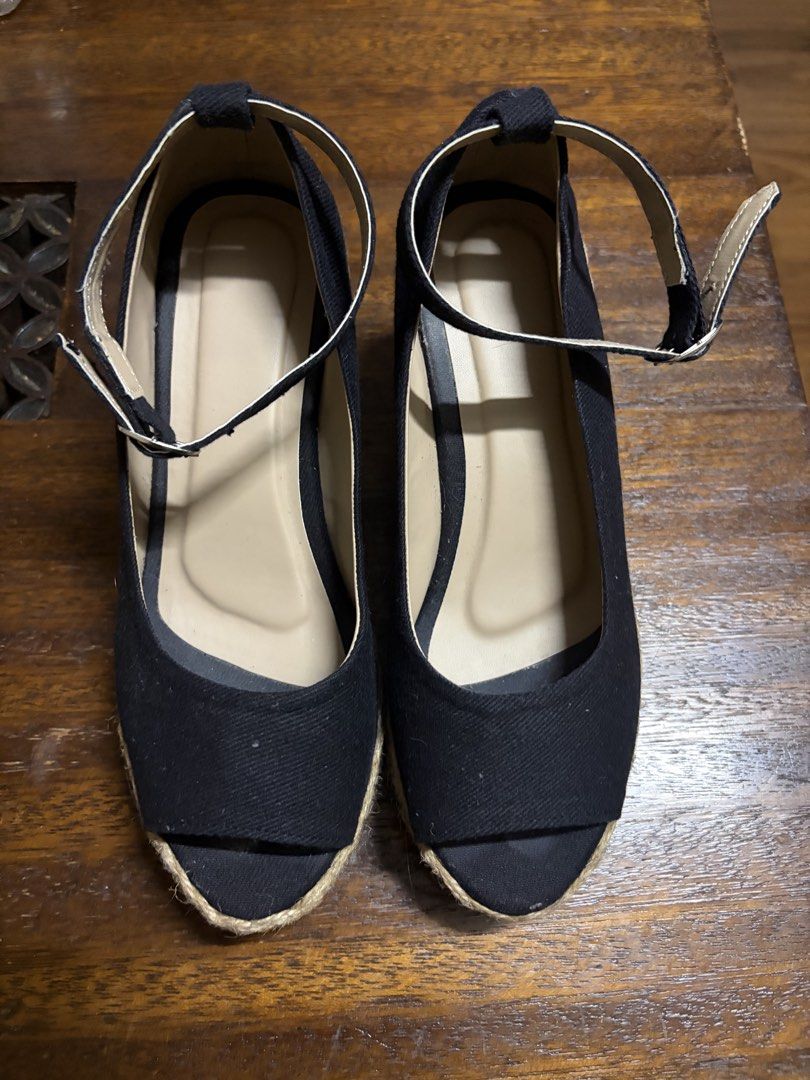 Black Espadrille Wedge Sandals with Ankle Strap (Category: Wedges) located in Manila. Submitted by ppurrrple__ (Listing ID 1441840655, Image 1). Description: - Black canvas peep-toe wedge sandals - Classic espadrille sole - Adjustable ankle strap for a secure fit - Comfortable and stylish for everyday wear - Versatile for dressing up or down NEGOTIABLE FOR SURE BUYER.