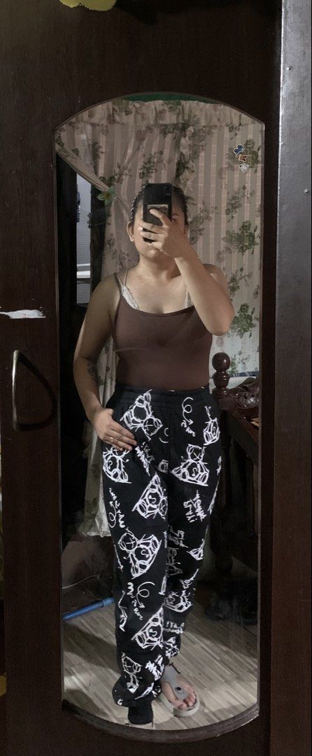 Black Pants with White Cartoon Print (Category: Other Bottoms) located in Caloocan City. Submitted by kimpatchieee (Listing ID 1441918399, Image 1). Description: - Comfy black pants - Fun white cartoon print all over - Elastic waistband for a comfortable fit - Ideal for lounging or casual wear - Easy to pair with any top - Unique and stylish design.