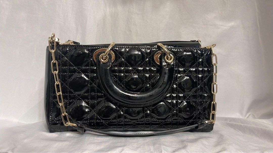 Black Patent Dior Lady Dior Bag (Category: Luxury Bags & Wallets) located in Lupao. Submitted by jennylynda42204 (Listing ID 1441905732, Image 3). Description: - Classic black patent leather Lady Dior bag - Iconic cannage stitching - Top handles - Detachable shoulder strap - Gold-tone hardware - Timeless and stylish for any occasion.