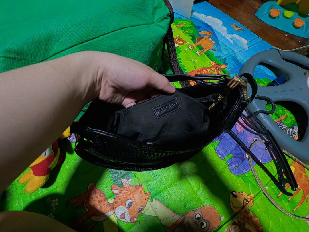 Black Woven Shoulder Bag with Gold Hardware (Category: Shoulder Bags) located in Manila. Submitted by naaraheve (Listing ID 1441850905, Image 1). Description: - Stylish black shoulder bag - Unique woven texture - Secure flap closure with gold button - Comes with a long, adjustable strap - Interior features a convenient smaller pouch - Ideal for everyday wear and errands.