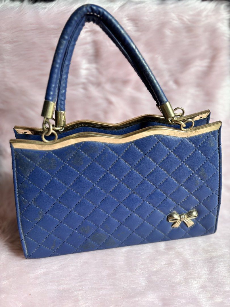 Blue Quilted Handbag with Bow Detail (Category: Luxury Bags & Wallets) located in Rizal. Submitted by llaayy_ (Listing ID 1441868124, Image 1). Description: Handbag Need cleaning only Minimal issue will see at the photo Ship via J&T or Lalamove RFS: Declutter.