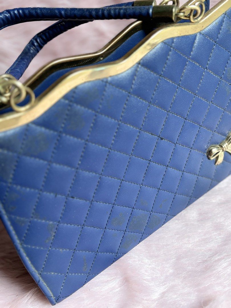 Blue Quilted Handbag with Bow Detail (Category: Luxury Bags & Wallets) located in Rizal. Submitted by llaayy_ (Listing ID 1441868124, Image 2). Description: Handbag Need cleaning only Minimal issue will see at the photo Ship via J&T or Lalamove RFS: Declutter.