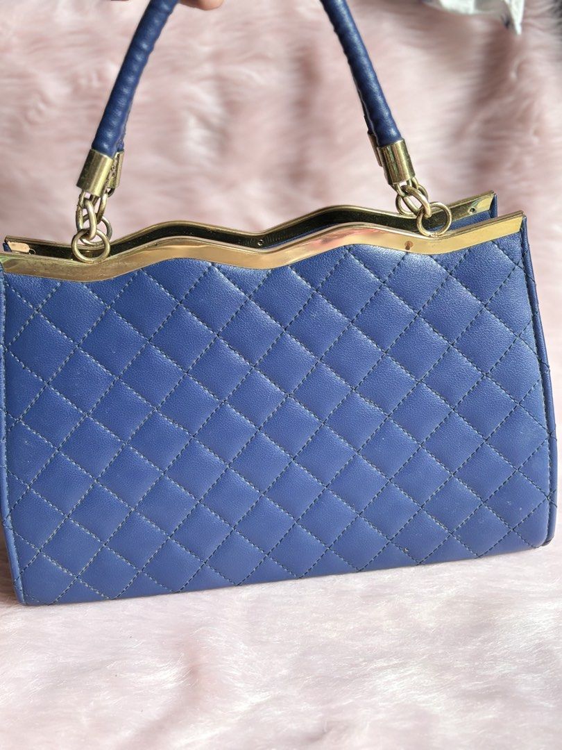 Blue Quilted Handbag with Bow Detail (Category: Luxury Bags & Wallets) located in Rizal. Submitted by llaayy_ (Listing ID 1441868124, Image 3). Description: Handbag Need cleaning only Minimal issue will see at the photo Ship via J&T or Lalamove RFS: Declutter.