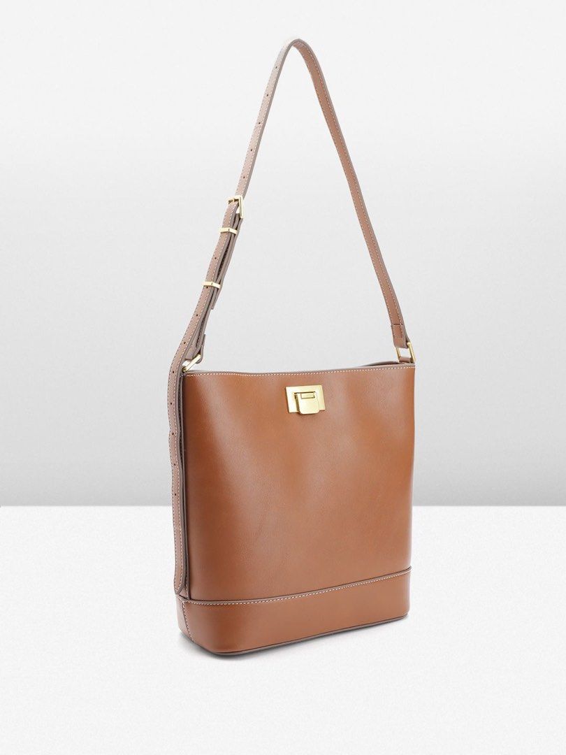 Brown Leather Bucket Bag with Gold Hardware (Category: Luxury Bags & Wallets) located in Manila. Submitted by shinigangster (Listing ID 1441841734, Image 1). Description: Mango Bag Hand and Shoulder Brown Never used (brand new) SRP is ₱2500 Selling for ₱1500 only 📍FAME Residences, Mandaluyong.