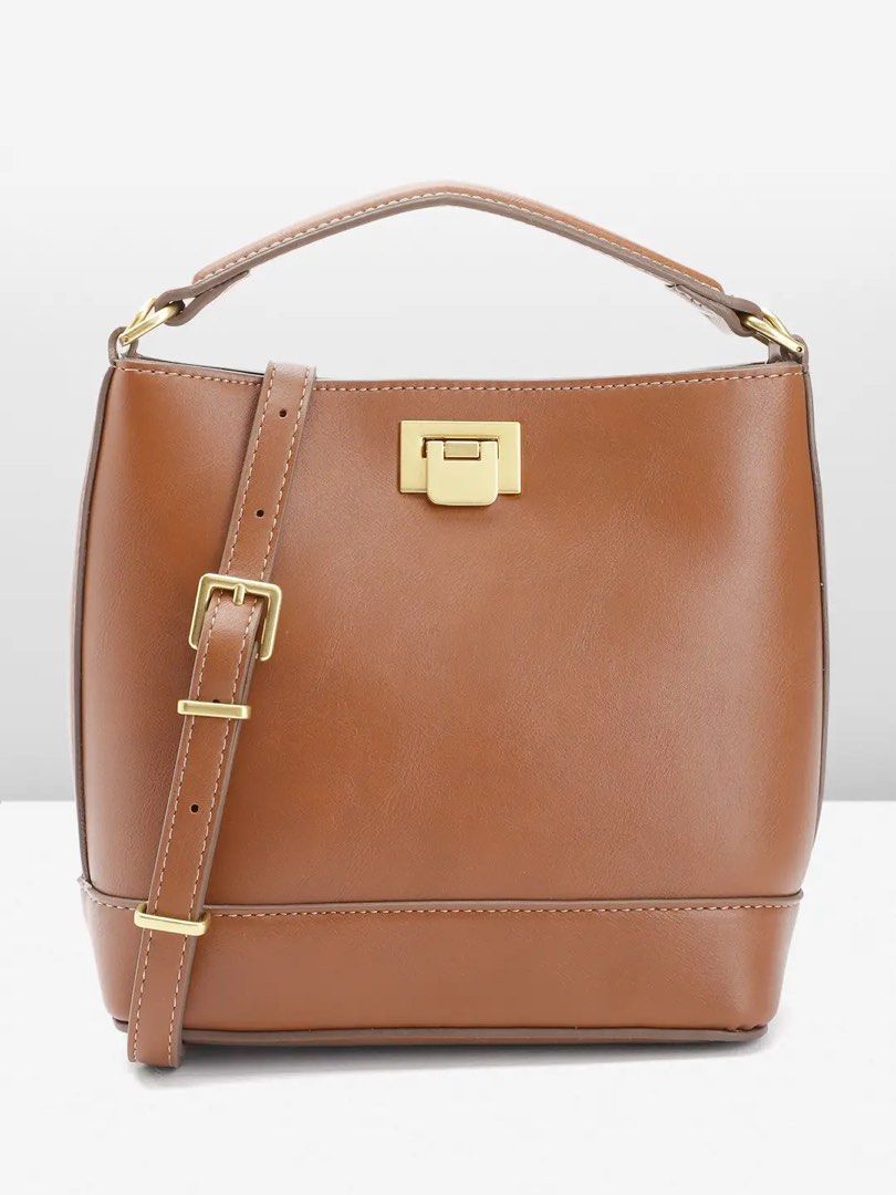 Brown Leather Bucket Bag with Gold Hardware (Category: Luxury Bags & Wallets) located in Manila. Submitted by shinigangster (Listing ID 1441841734, Image 2). Description: Mango Bag Hand and Shoulder Brown Never used (brand new) SRP is ₱2500 Selling for ₱1500 only 📍FAME Residences, Mandaluyong.