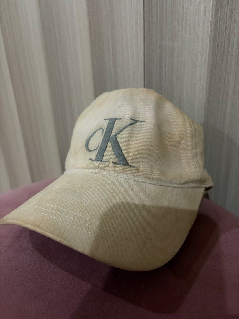 Calvin Klein CK Beige Cotton Baseball Cap (Category: Caps & Hats) located in Mandaluyong City. Submitted by getbounced (Listing ID 1441882693, Image 1). Description: - Beige Calvin Klein cap - Features iconic CK logo on the front - Made from 100% cotton for comfort - One size fits most - Perfect for everyday casual styling.