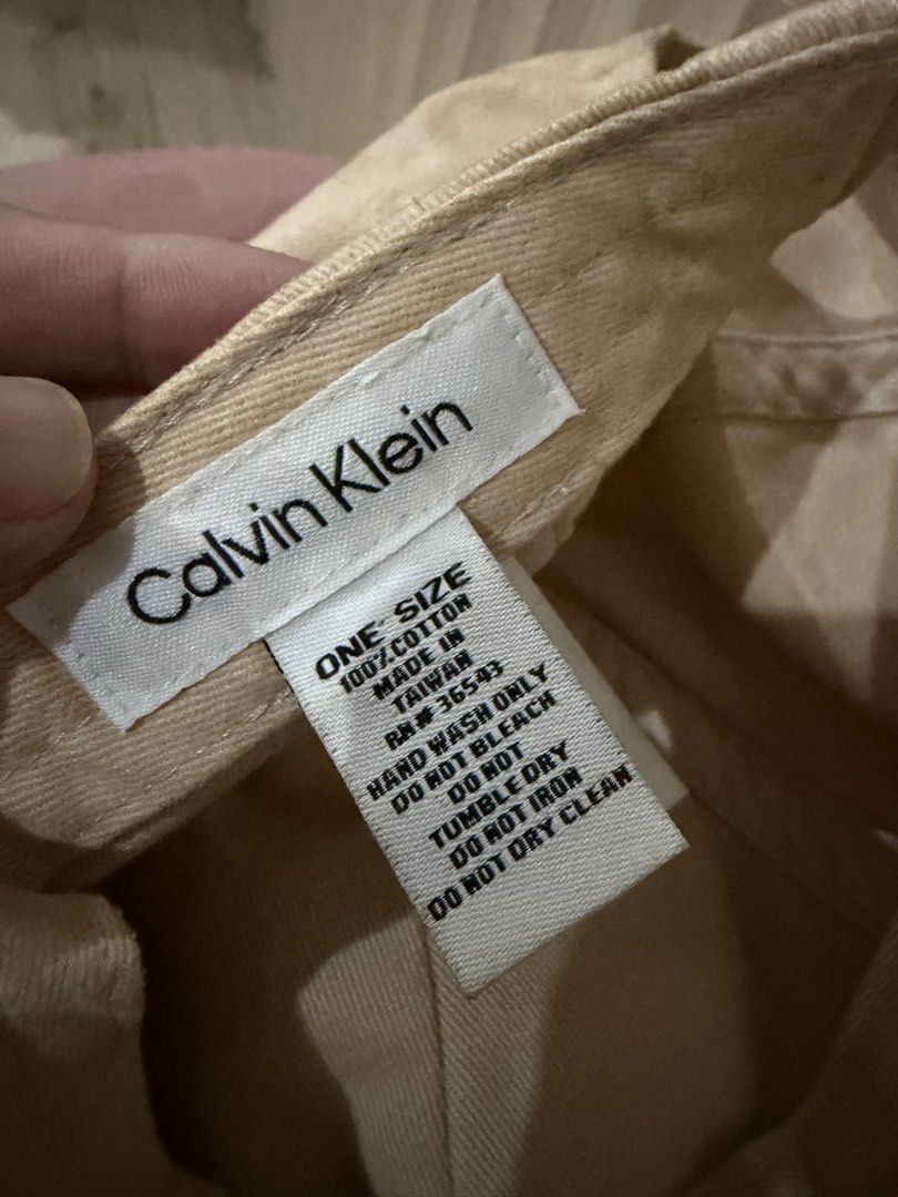 Calvin Klein CK Beige Cotton Baseball Cap (Category: Caps & Hats) located in Mandaluyong City. Submitted by getbounced (Listing ID 1441882693, Image 3). Description: - Beige Calvin Klein cap - Features iconic CK logo on the front - Made from 100% cotton for comfort - One size fits most - Perfect for everyday casual styling.
