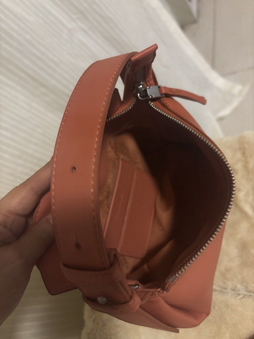 Calvin Klein Leather Shoulder Bag with Strap (Category: Shoulder Bags) located in Dinalupihan. Submitted by pinkshop21 (Listing ID 1441887778, Image 3). Description: - Genuine red leather Calvin Klein handbag - Features a comfortable top handle - Includes a detachable shoulder strap for versatile carrying - Secure zipper closure - Interior card slots for organization - Ideal everyday bag.