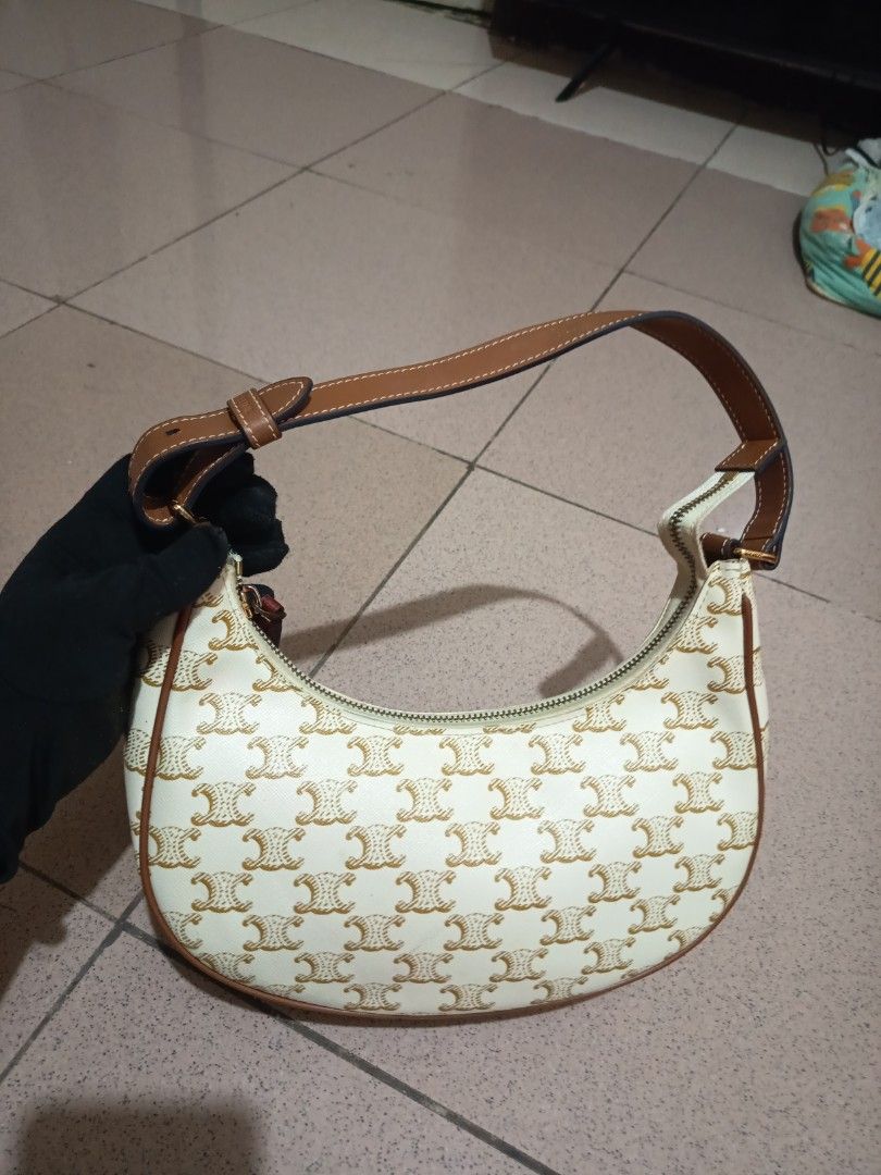 CELINE WHITE TRIOMPHE SHOULDER BAG (Category: Luxury Bags & Wallets) located in Bulacan. Submitted by wendyluxury (Listing ID 1441888593, Image 3). Description: Celine Ava shoulder bag is crafted from white Triomphe coated canvas with tan leather trim. white color with code good condition.