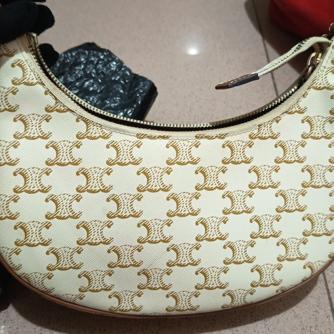 CELINE WHITE TRIOMPHE SHOULDER BAG (Category: Luxury Bags & Wallets) located in Bulacan. Submitted by wendyluxury (Listing ID 1441888593, Image 2). Description: Celine Ava shoulder bag is crafted from white Triomphe coated canvas with tan leather trim. white color with code good condition.