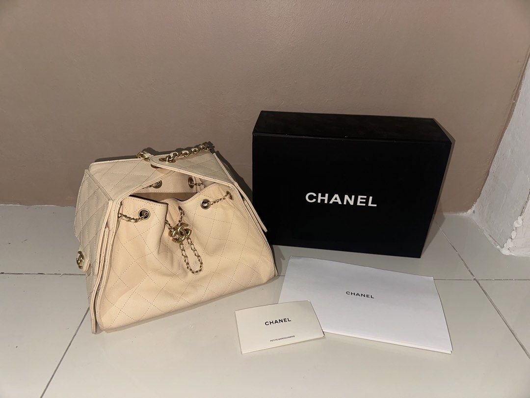 Chanel 25 Mini Beige Quilted Leather Drawstring Shoulder Bag (Category: Luxury Bags & Wallets) located in Manila. Submitted by beomcyj (Listing ID 1441853153, Image 2). Description: - Authentic Beige Chanel 25 Shoulder Bag - Classic Quilted Leather - Gold Chain Strap - Includes Original Dust Bag and Box - Interior Tag: Chanel Made in Italy - Front Flap Pocket with CC Logo Closure - Secure Drawstring Closure at Top.