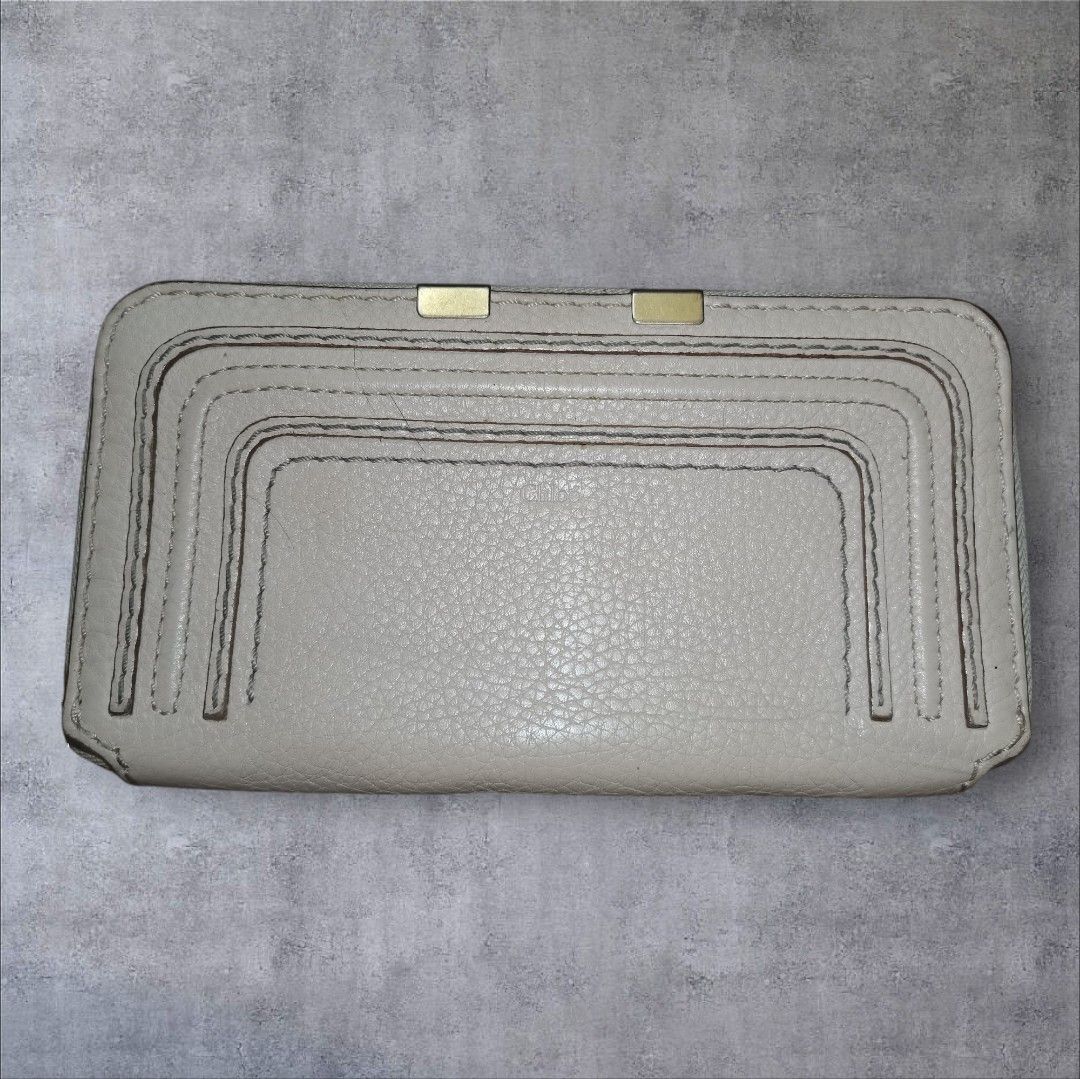 Chloe Marcie Long Wallet Grey Textured Leather (Category: Luxury Bags & Wallets) located in Manila. Submitted by eagerbeaverph (Listing ID 1441864273, Image 1). Description: Chloe marcie long wallet H 4.5 inches W 7.5 Signs of usage Broken zipper puller Zipper liner works fine Please see detailed pics Neg Dm.