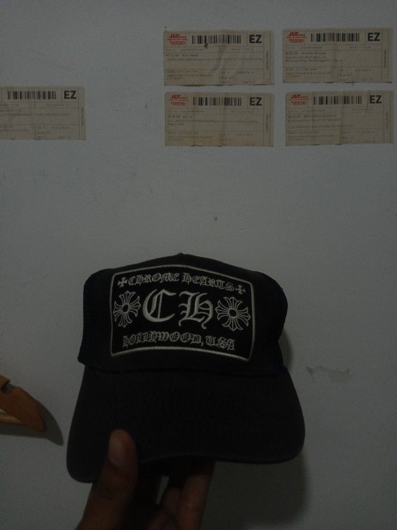 Chrome Hearts Hollywood USA Cap (Category: Caps & Hats) located in Manila. Submitted by johnmichae31756 (Listing ID 1441904506, Image 1). Description: - Black cap with Chrome Hearts logo - Features 'CH' and 'Hollywood, USA' text - Ideal for casual wear - Shows some signs of use.