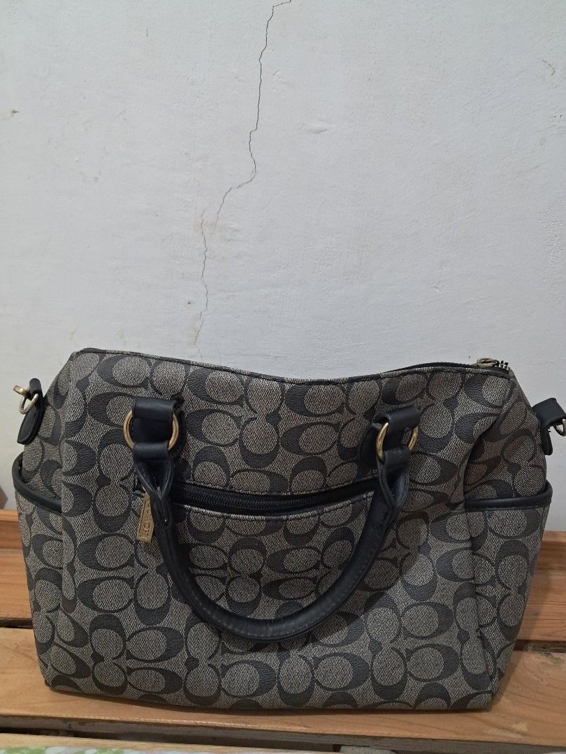 Coach Monogram Bag with Strap (Category: Luxury Bags & Wallets) located in Bacoor. Submitted by kjbcloset (Listing ID 1441790615, Image 2). Description: - Classic Coach monogram canvas satchel - Dark grey and black pattern - Leather handles and trim - Zipper closure - Multiple interior compartments - Detachable shoulder strap included - Great for everyday use - Zipper inside of bag is broken but unnoticeable .