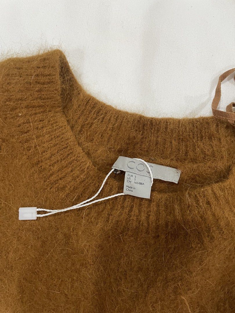COS Brown Wool Sweater FREE SHIPPING (Category: Coats, Jackets and Outerwear) located in Tagbilaran City. Submitted by dianne.closet (Listing ID 1441833712, Image 2). Description: - Brand: COS - Color: Brown - Material: Angora and wool blend - Texture: Fuzzy - Condition: New, tag detached, never worn - Size small, stretchy - Style: cropped length - Purchased from a Carouseller. I’m reselling it because the fabric inside (except for the sleeves) f