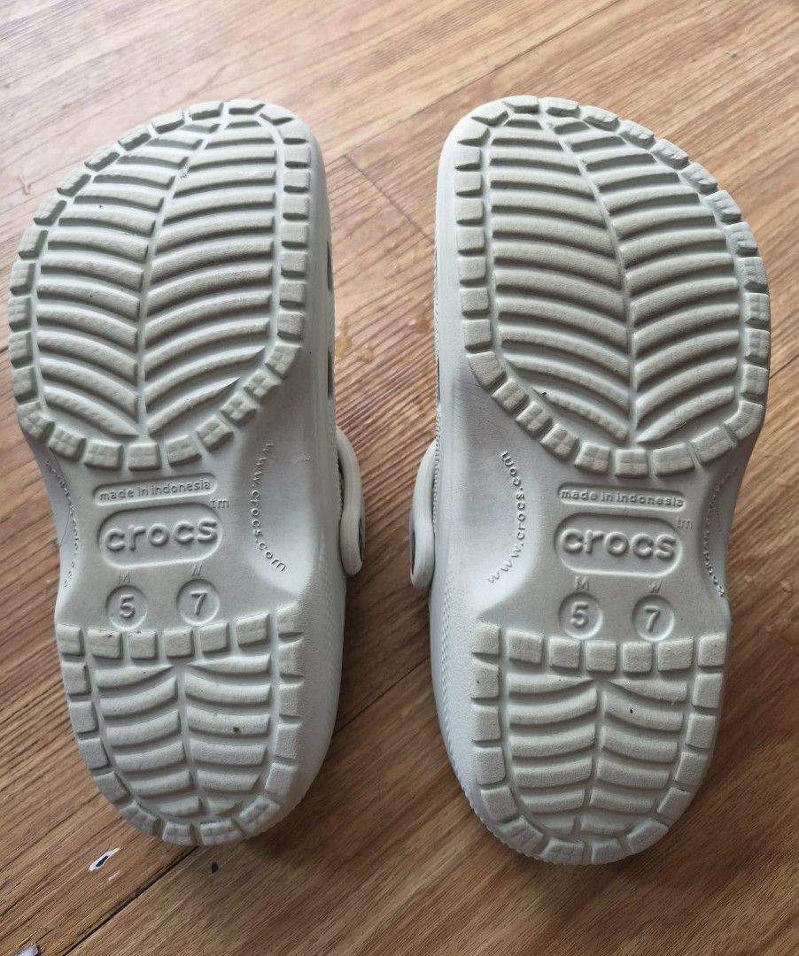 Original Crocs Clogs (Category: Slippers and slides) located in Manila. Submitted by melissaga98708 (Listing ID 1441839674, Image 3). Description: - Original Light Grey/Light Green Crocs clogs - Blurry logo due to wear and tear - Includes free Jibbitz charm - Sf to be shouldered by buyer.