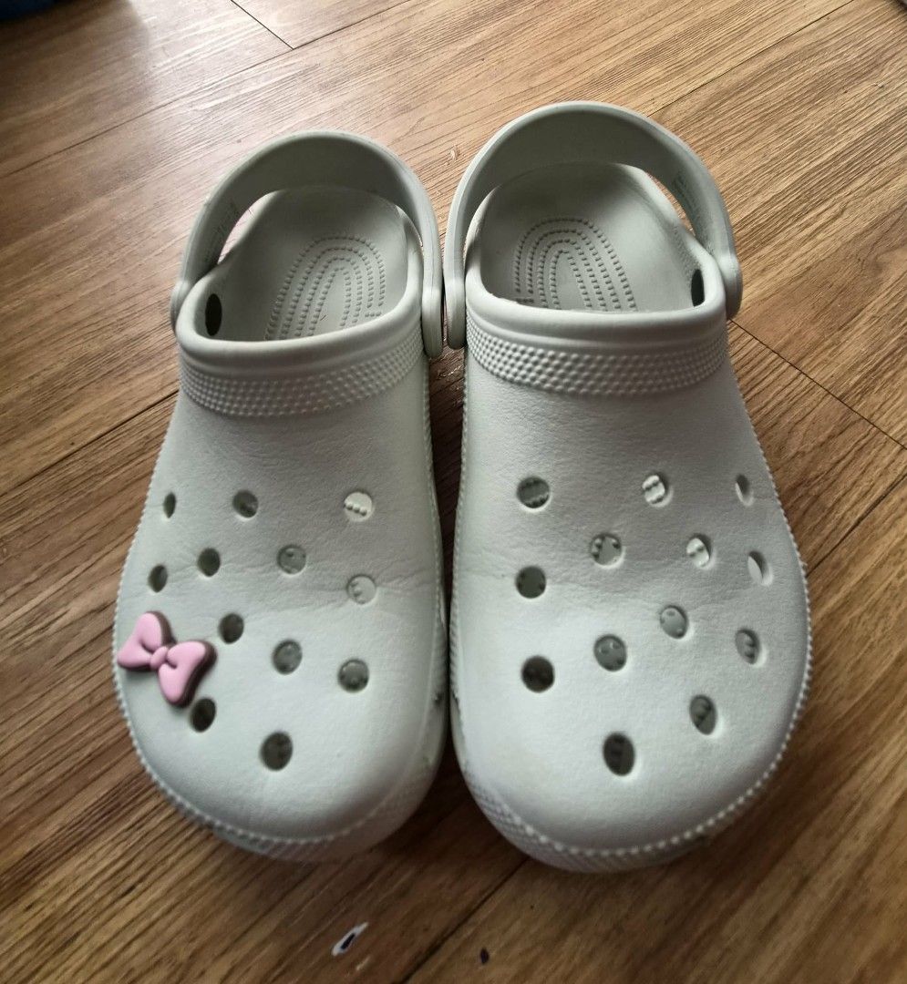 Original Crocs Clogs (Category: Slippers and slides) located in Manila. Submitted by melissaga98708 (Listing ID 1441839674, Image 2). Description: - Original Light Grey/Light Green Crocs clogs - Blurry logo due to wear and tear - Includes free Jibbitz charm - Sf to be shouldered by buyer.