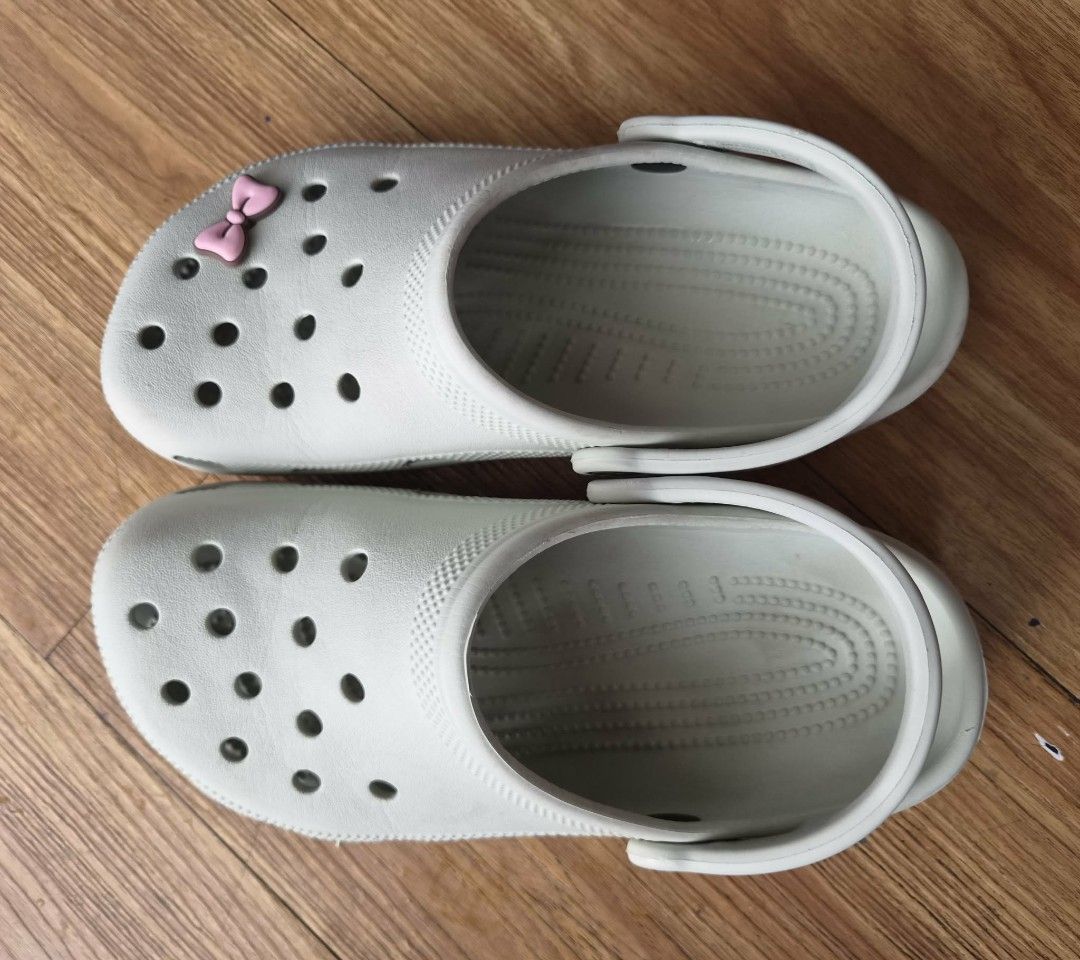 Original Crocs Clogs (Category: Slippers and slides) located in Manila. Submitted by melissaga98708 (Listing ID 1441839674, Image 1). Description: - Original Light Grey/Light Green Crocs clogs - Blurry logo due to wear and tear - Includes free Jibbitz charm - Sf to be shouldered by buyer.