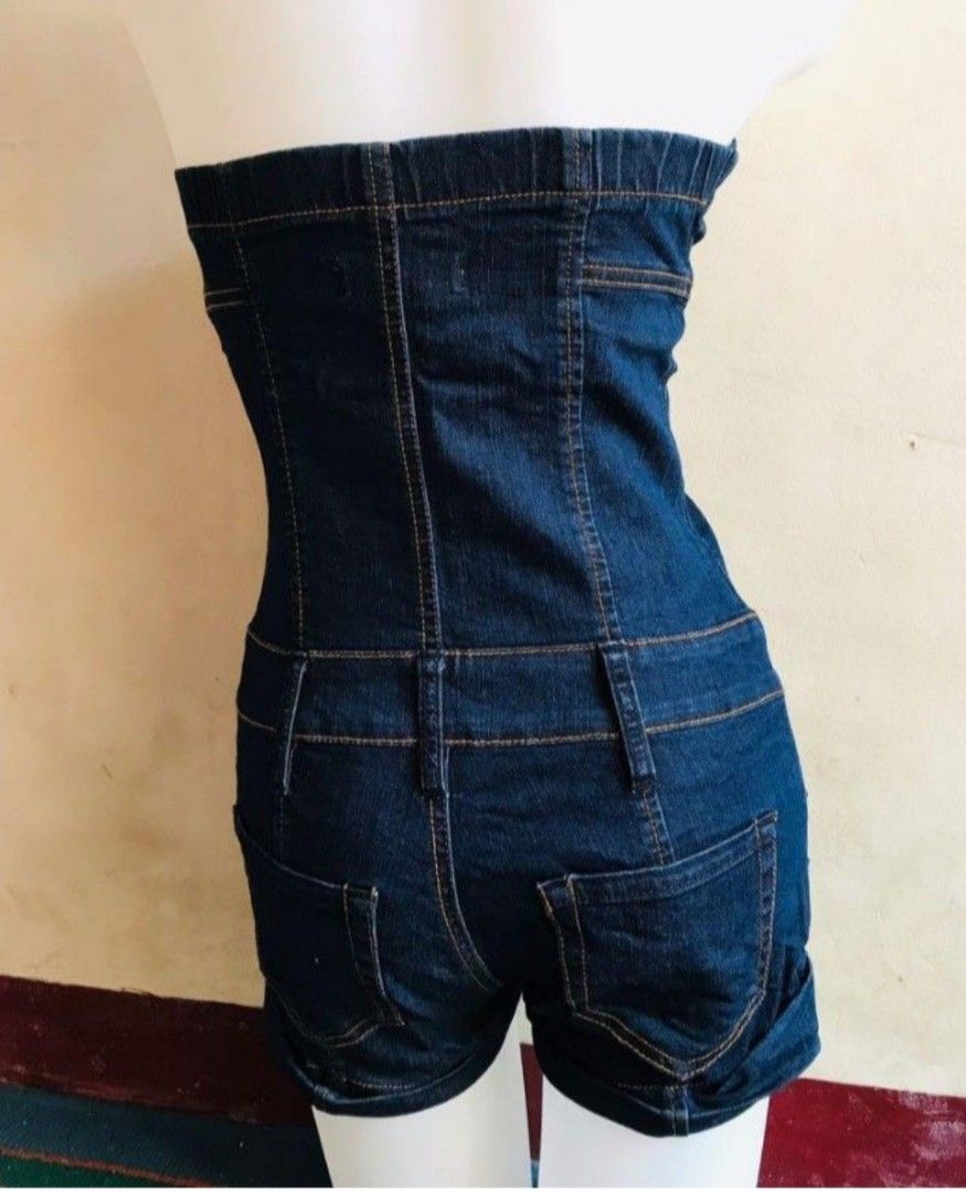 Dark Wash Denim Strapless Short Jumpsuit (Category: Jumpsuits) located in Las Pinas. Submitted by ZHOEYCLOTHING (Listing ID 1441878849, Image 2). Description: - Dark wash denim strapless jumpsuit with shorts - Button and zip closure at the front - Functional pockets - Stylish stitching detail throughout - Elasticated back for a comfortable, snug fit - Versatile for casual day or night out.