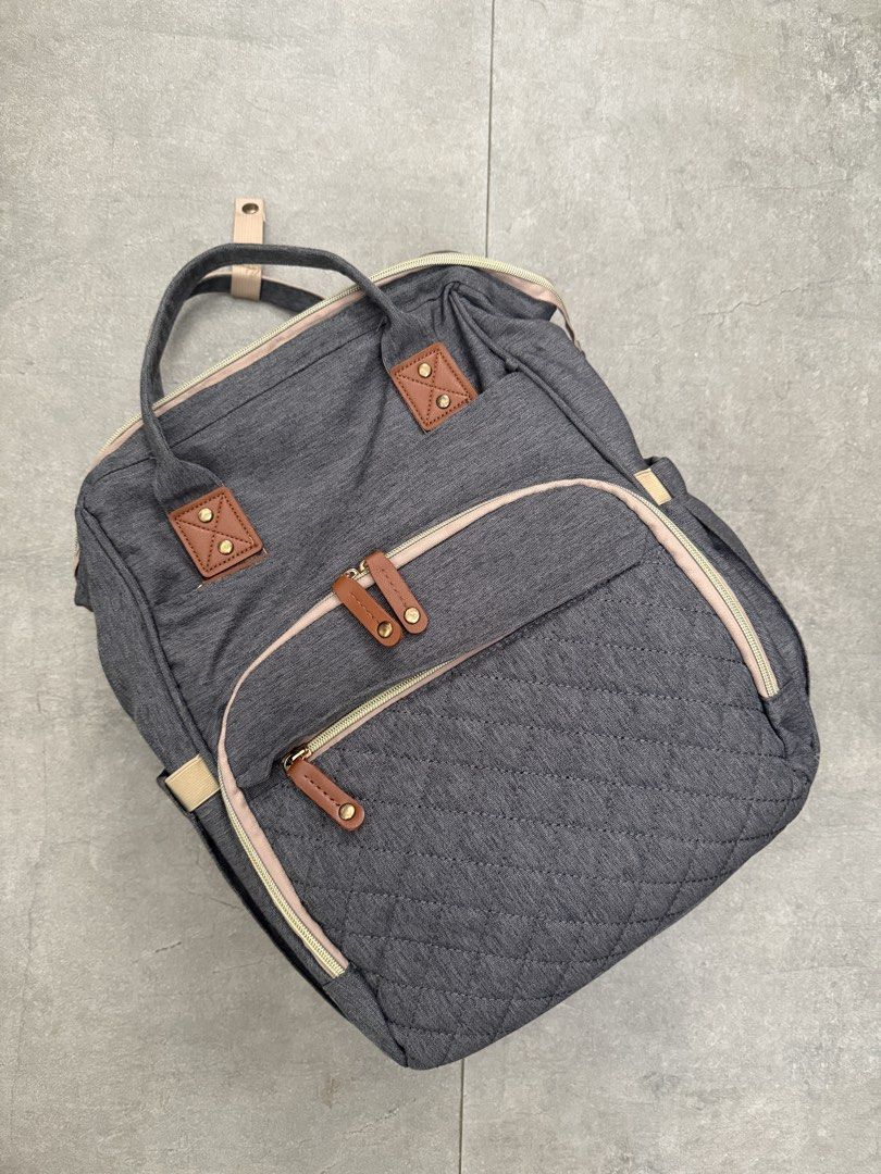 Diaper Bag Backpack - 2in1 (Category: Backpacks) located in Cainta. Submitted by chaspreloved (Listing ID 1441921072, Image 1). Description: - Multifunctional Diaper Bag: Backpack that transforms into a changing mat - Ideal for baby outings and travel. - Made from durable nylon cloth. - Versatile carrying options: backpack or single shoulder bag. - Features breathable fence on both sides for comfort. - Includes bracket fixation for secure crib fu