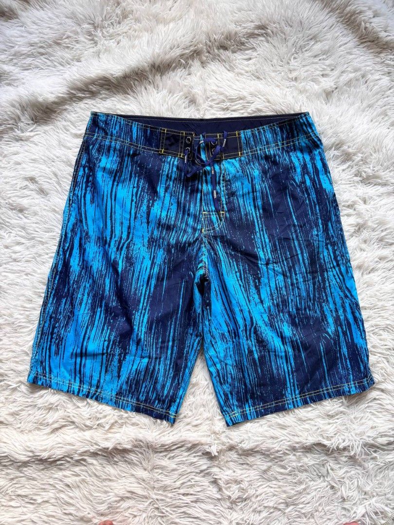 Diesel Board Shorts Blue Abstract Print (Category: Shorts) located in Catbalogan. Submitted by kristinapi (Listing ID 1441818976, Image 2). Description: - Brand: Diesel - Size: XL - Color/Print: Cool blue abstract print - Features: Drawstring waist, velcro fly, back pocket with button closure - Interior: Mesh lining - Ideal for: Swimming, pool lounging.