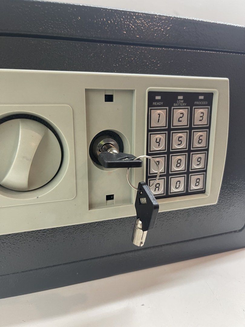 Digital Electronic Safe Box with Key Lock (Category: Safe) located in Mandaluyong City. Submitted by manilasyoungstunna (Listing ID 1441847671, Image 2). Description: Needs battery Price negotiable - Digital keypad with key override for secure access - Indicator lights for power status (ready) and low battery - Interior lined with soft felt to protect contents - Minor scratches on the exterior top surface - Perfect for securing valuables at home 