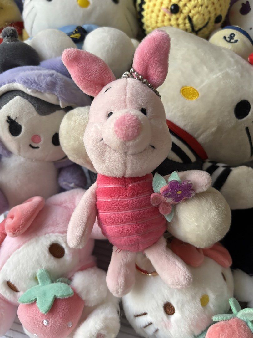 Disney Piglet Plush Keychain with Flower Charm (Category: Plushies & Soft Toys) located in Manila. Submitted by mpt99876 (Listing ID 1441798537, Image 1). Description: - Adorable Disney Piglet plush keychain - Features a pink, striped body - Comes with a cute flower charm - Small and portable, ideal for attaching to bags or keys - A must-have for any Disney fan!.