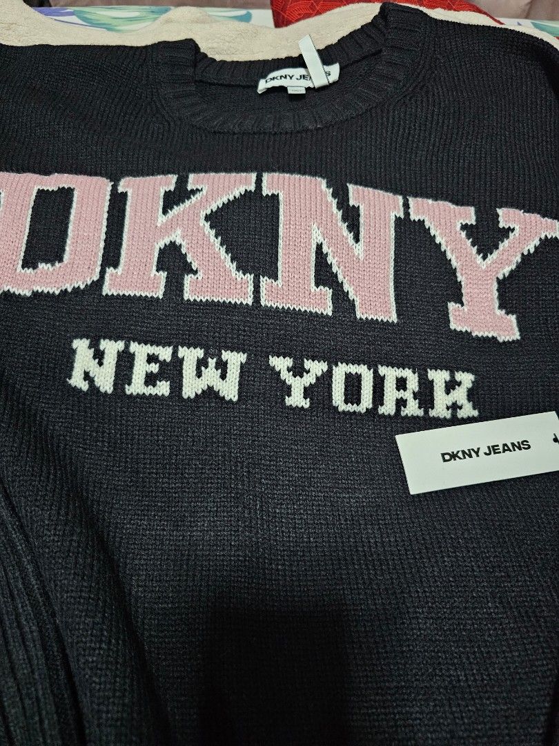 DKNY New York Knit Sweater (Category: Longsleeves) located in Davao. Submitted by dahl957172787 (Listing ID 1441946597, Image 3). Description: - Black DKNY New York knit sweater - Long sleeves with ribbed cuffs - Classic crew neck - Pink and white DKNY logo detail - Brand new with original tags attached - Ideal for casual wear.