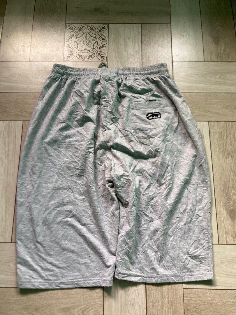 Ecko Unltd. Grey Athletic Shorts Men's Size Large (Category: Shorts) located in Caloocan City. Submitted by johnlicup287551 (Listing ID 1441821938, Image 3). Description: Ecko Unltd. grey athletic shorts. Features Ecko logo on back pocket, large graphic on left leg, and elastic waistband with drawstring. Perfect for lounging or workouts..