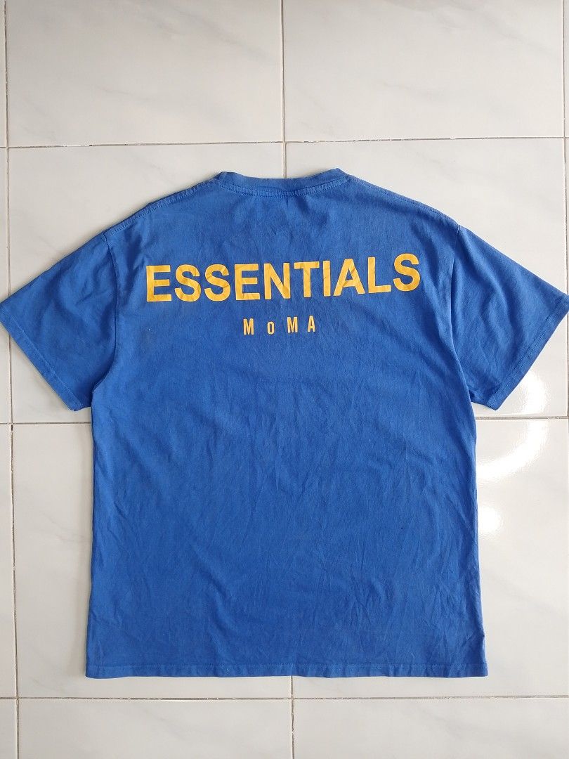 Fear of God Essentials MoMA T-shirt Blue Size M (Category: Tshirts & Polo Shirts ) located in Bambang. Submitted by kate_zian (Listing ID 1441802514, Image 2). Description: Width: 23 Length: 27.5 Size on tag: Medium Color Rate: 9/10 Condition: 9.5 Issue: unnoticeable fade spots.