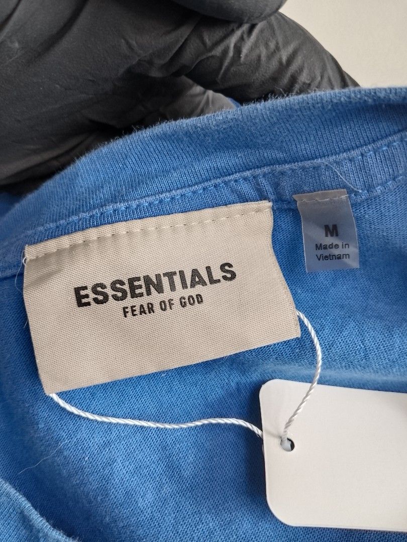 Fear of God Essentials MoMA T-shirt Blue Size M (Category: Tshirts & Polo Shirts ) located in Bambang. Submitted by kate_zian (Listing ID 1441802514, Image 3). Description: Width: 23 Length: 27.5 Size on tag: Medium Color Rate: 9/10 Condition: 9.5 Issue: unnoticeable fade spots.