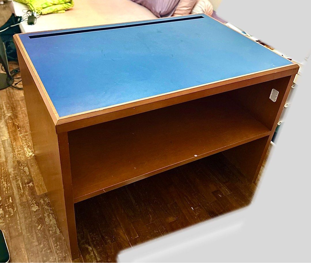 Free Table (Category: Tables & Sets) located in Singapore. Submitted by zenzl (Listing ID 1441921299, Image 1). Description: Wooden table with storage below. One side bottom wood has damaged.