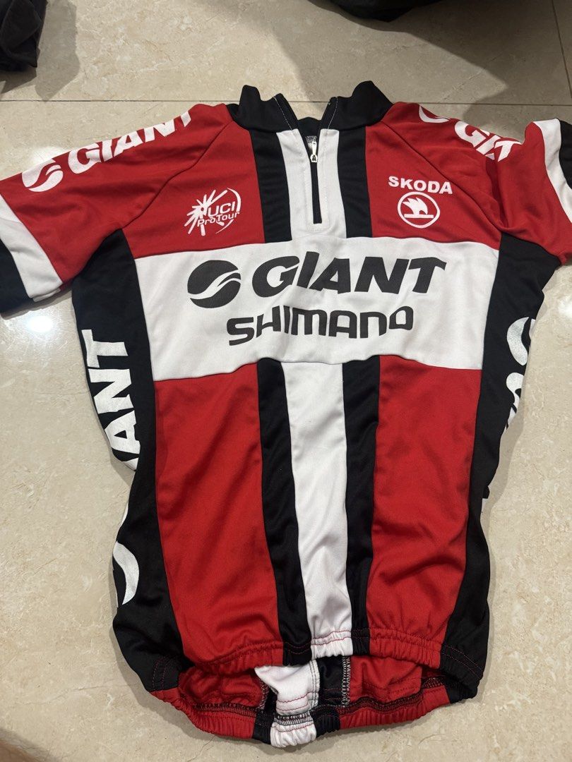 Giant Shimano UCI Cycling Jersey (Category: Activewear) located in Abucay. Submitted by nxspace (Listing ID 1441865849, Image 1). Description: FOR KIDS / SMALL SIZE - Red, black, and white cycling jersey - Features Giant and Shimano branding - Includes UCI logo - Full front zipper for ventilation - Elasticated hem for a secure fit - Ideal for cycling enthusiasts.