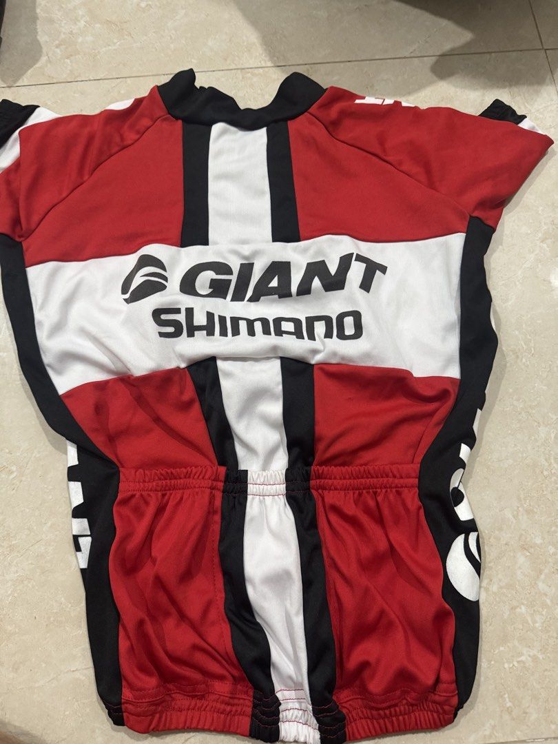 Giant Shimano UCI Cycling Jersey (Category: Activewear) located in Abucay. Submitted by nxspace (Listing ID 1441865849, Image 2). Description: FOR KIDS / SMALL SIZE - Red, black, and white cycling jersey - Features Giant and Shimano branding - Includes UCI logo - Full front zipper for ventilation - Elasticated hem for a secure fit - Ideal for cycling enthusiasts.