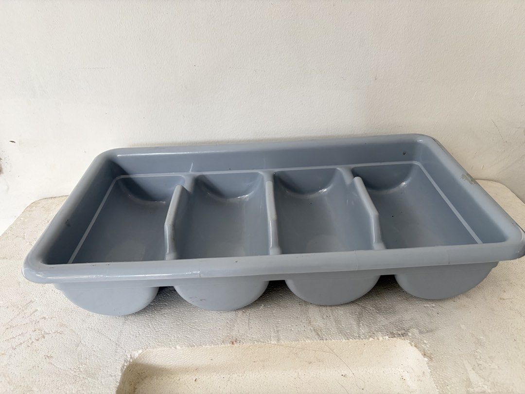 Grey 4 Compartment Cutlery Tray Organizer (Category: Dinnerware & Cutlery) located in Taguig. Submitted by miyukisbabyshopp_218 (Listing ID 1441817220, Image 2). Description: - Grey plastic cutlery organizer - Features 4 compartments for tidy utensil storage - Fits most standard drawers - Ideal for a neat and organized kitchen - Simple and functional design.