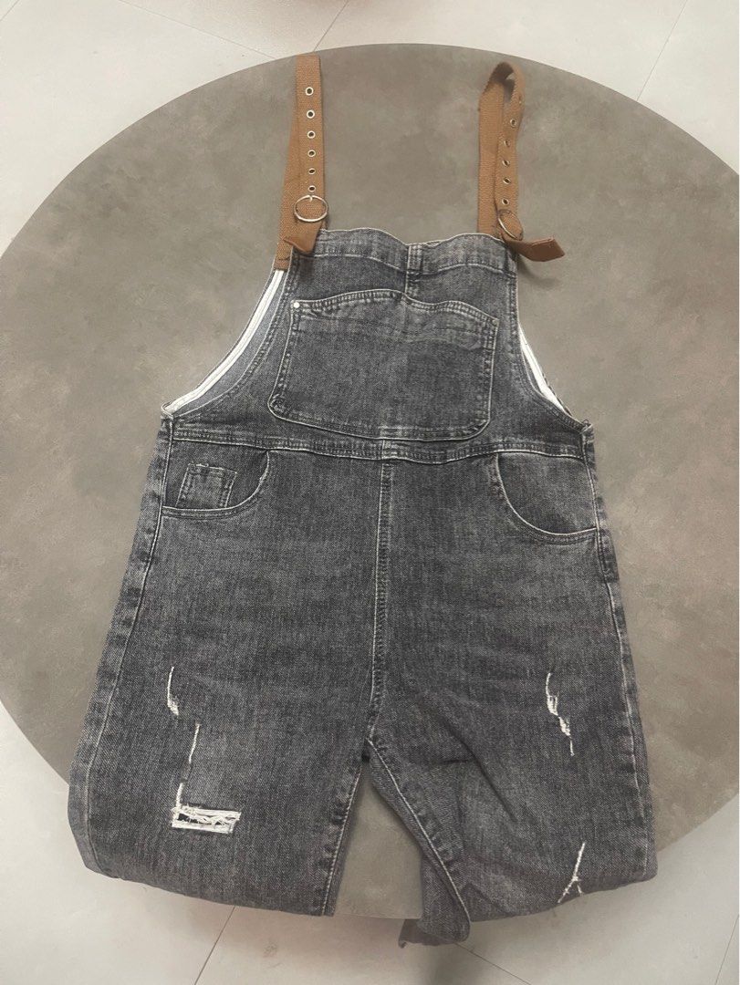 Grey Distressed Denim Overalls, Jumper (Category: Jumpsuits) located in Lucena. Submitted by halfrackph (Listing ID 1441902841, Image 1). Description: - Grey denim overalls - Distressed details on legs and pockets - Adjustable buckle straps with ring details - Two front and two back pockets - Size L - Ideal for a casual look.