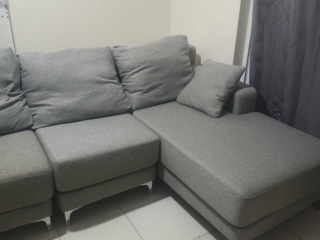 Grey L-Shaped Sectional Sofa with Chaise (Category: Sofas) located in Manila. Submitted by vernon27 (Listing ID 1441933561, Image 3). Description: OUR HOME Cyril II L-Shape Sofa / Sectional Sofa Bought for around ₱45,000. Selling for ₱28,000. Current/posted price from Our Home was around ₱45K depending on promo. Modern gray fabric L-shaped sofa with chaise lounge. Used with a sofa cover most of the time; cover was removed only for picture taking.