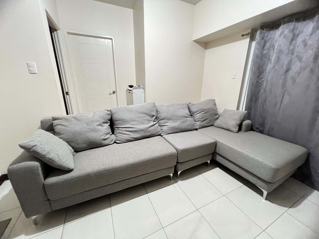Grey L-Shaped Sectional Sofa with Chaise (Category: Sofas) located in Manila. Submitted by vernon27 (Listing ID 1441933561, Image 2). Description: OUR HOME Cyril II L-Shape Sofa / Sectional Sofa Bought for around ₱45,000. Selling for ₱28,000. Current/posted price from Our Home was around ₱45K depending on promo. Modern gray fabric L-shaped sofa with chaise lounge. Used with a sofa cover most of the time; cover was removed only for picture taking.