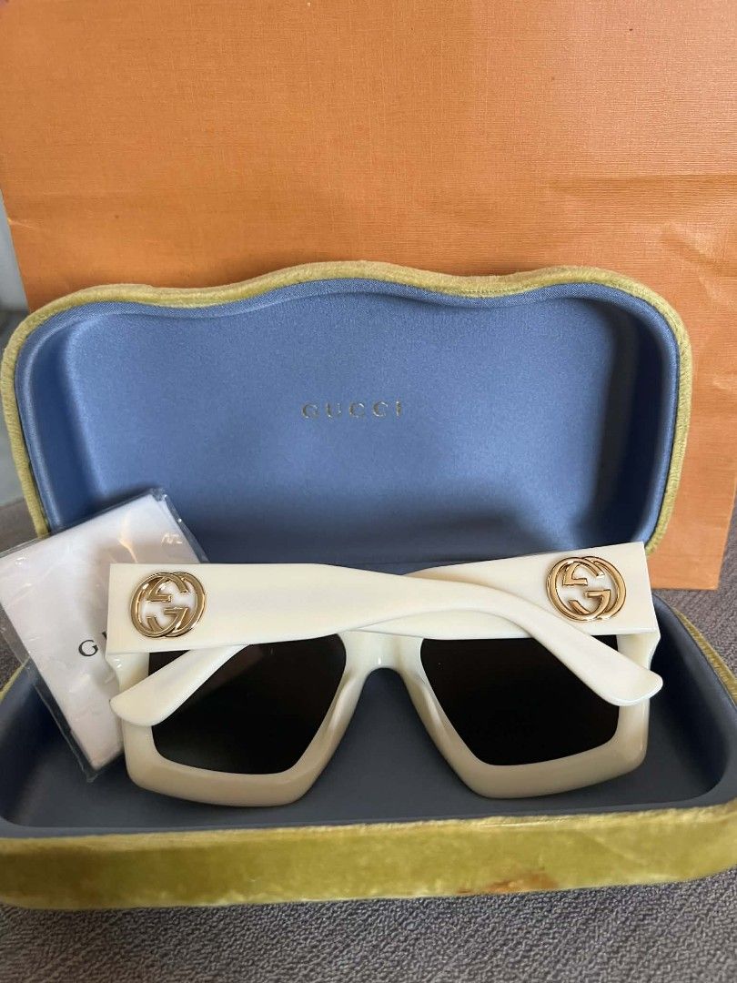 Gucci Sunglasses with Star Embellishments (Category: Sunglasses & Eyewear) located in Manila. Submitted by supermom888 (Listing ID 1441820995, Image 2). Description: - Authentic White Gucci Sunglasses - Embellished with sparkling gold stars around the frame - Comes with original Gucci case and cleaning cloth - Unique green lightning bolt pattern on the lenses - Perfect statement accessory to elevate any outfit.