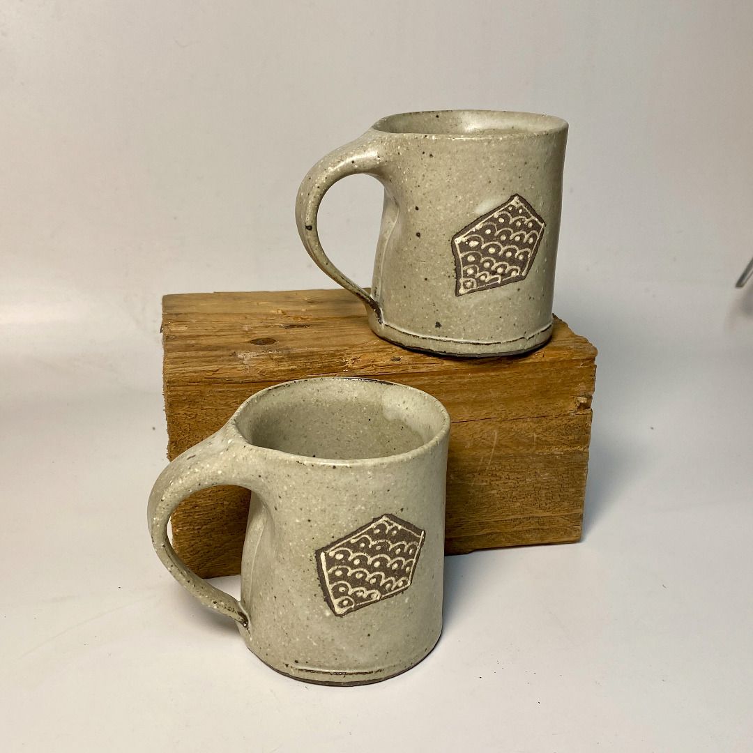 Handmade Ceramic Espresso Mug with Geometric Design (Category: Coffee & Tea Tableware) located in Quezon City. Submitted by madiscollectibles (Listing ID 1441924240, Image 2). Description: - Set of 2 handmade ceramic mugs - Unique geometric stamped patterns on each mug - Speckled light grey glaze - Ideal for coffee or tea - Artisanal and one-of-a-kind pieces.