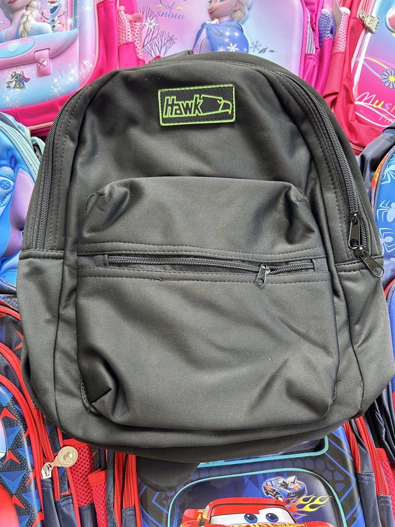 Hawk Backpack Black (Category: Backpacks) located in Roxas City. Submitted by kaisclstrxs_5801 (Listing ID 1441911608, Image 1). Description: - Classic black backpack - Front zip pocket for easy access - Small Hawk logo patch on the front - Adjustable shoulder straps for a comfortable fit - Standard size, ideal for school or everyday use.