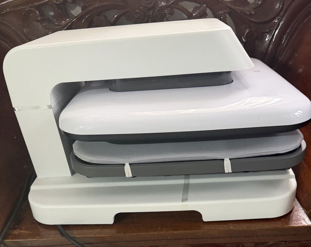 HTVRONT Auto Heat Press Machine for T-shirts & More (Category: Office & Business Technology) located in Meycauayan. Submitted by room_declutter (Listing ID 1441830641, Image 2). Description: - HTVRONT Auto Heat Press Machine - Ideal for T-shirts, hats, mugs, and various crafts - Features a convenient and safe pullout drawer design - Offers multiple preset and custom modes for quick settings - User-friendly for all crafting levels - Compatible wit