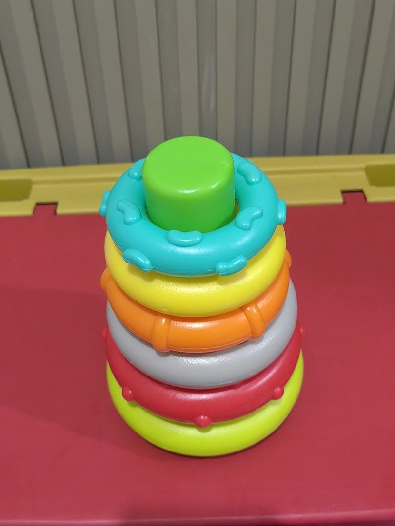 Infantino Rock-and-Stack Stacking Rings Toy (Category: Infant Playtime) located in Tagaytay City. Submitted by mrskai (Listing ID 1441905361, Image 2). Description: -Infantino Stacking Ring Toy -BPA free - Classic stacking rings toy - Bright, engaging colors - Aids in developing motor skills and hand-eye coordination - Complete set: includes base, rings, and topper - Ideal for babies and toddlers learning to stack Reason for Selling: Outgrown.