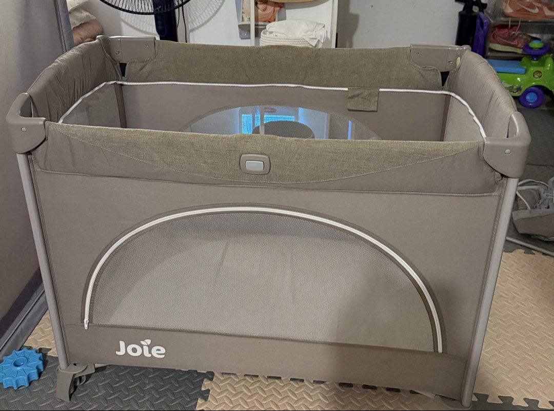 Joie Crib (Category: Cots & Cribs) located in San Pablo. Submitted by oliviacloset.ph (Listing ID 1441849114, Image 3). Description: Selling our Joie baby playpen/travel cot in very good condition. Clean, sturdy, and well looked after. Perfect for babies and toddlers as a safe sleeping or play area at home or while traveling. Features: ✅ Spacious and sturdy design ✅ Mesh sides for visibility and airflow ✅ Side zip opening for easy access ✅ Includ