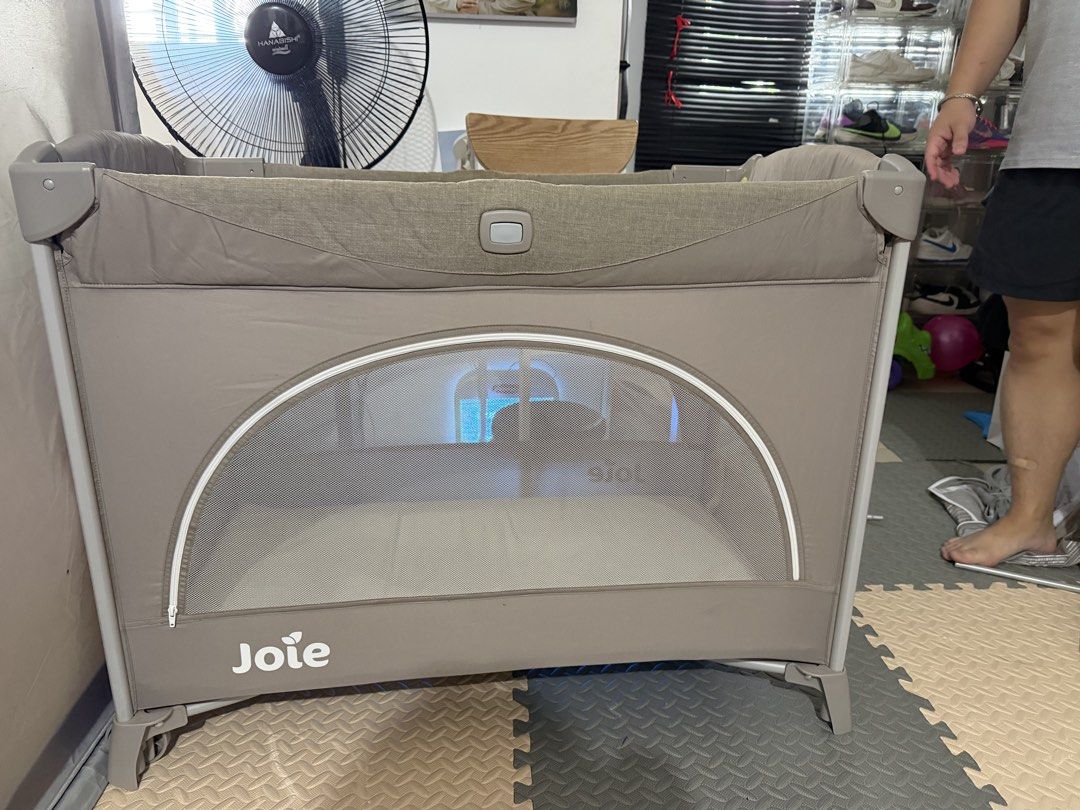 Joie Crib (Category: Cots & Cribs) located in San Pablo. Submitted by oliviacloset.ph (Listing ID 1441849114, Image 1). Description: Selling our Joie baby playpen/travel cot in very good condition. Clean, sturdy, and well looked after. Perfect for babies and toddlers as a safe sleeping or play area at home or while traveling. Features: ✅ Spacious and sturdy design ✅ Mesh sides for visibility and airflow ✅ Side zip opening for easy access ✅ Includ