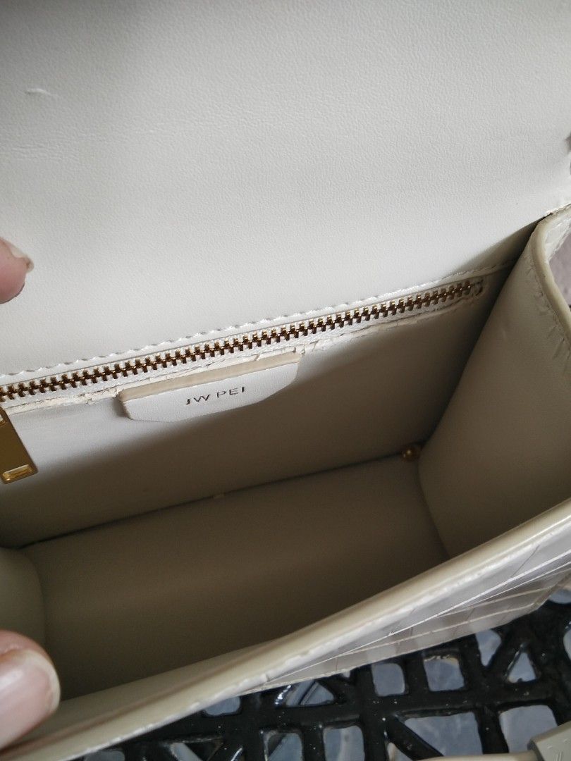 JW Pei Cream Croc Embossed Shoulder Bag (Category: Shoulder Bags) located in Bugasong. Submitted by sofiewaffle (Listing ID 1441920013, Image 3). Description: - Elegant cream shoulder bag - Luxurious croc embossed texture - Stylish gold hardware details - Secure zipper closure inside - Convenient magnetic snap flap closure - Adjustable strap for a customized fit - Clean and spacious interior - Ideal for everyday use and carrying your essentials -