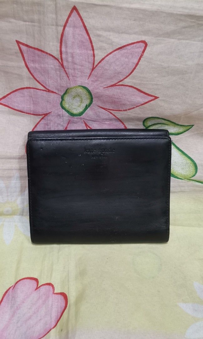KATE SPADE black leather short wallet (Category: Wallets & Card holders) located in Baguio. Submitted by princessjhade (Listing ID 1441838703, Image 1). Description: Good condiyion With minimal signs of use Plus shipping.
