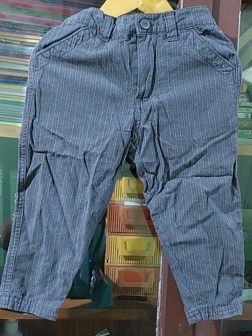 Kenneth Cole Reaction Striped Pants (Category: Babies & Kids Fashion) located in San Juan City. Submitted by misismorena (Listing ID 1441792588, Image 1). Description: - Stylish grey pants with subtle white pinstripes. - Comfortable elastic waistband with a secure button closure. - Trendy cuffed ankles for a modern look. - Made from breathable 100% cotton, perfect for all-day comfort. - Versatile design, ideal for everyday casual wear..