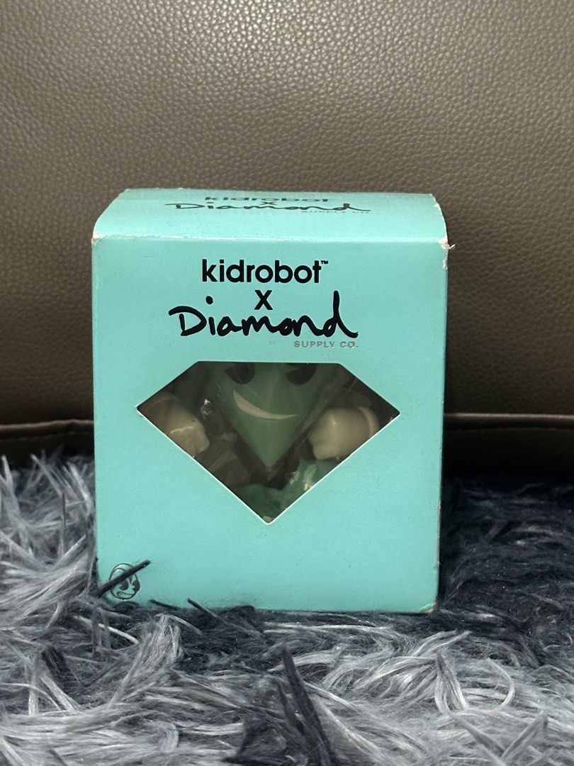 Kidrobot x Diamond Supply Co. Figure (Category: Designer & Blind Box Toys) located in Manila. Submitted by markjason420 (Listing ID 1441858339, Image 1). Description: - Kidrobot x Diamond Supply Co. collectible figure - Comes in original box - Excellent addition for collectors -Tiffany Color-way Rare.